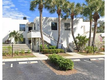 Exterior view of a two-story building with stairs and parking at 226 Lakewood Dr # 226, Bradenton, FL 34210