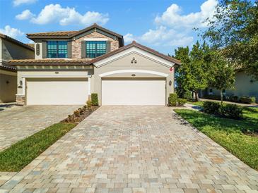Two-story townhome with two-car garage and paver driveway at 17825 Gawthrop Dr # 104, Bradenton, FL 34211
