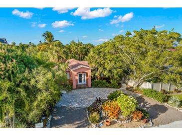 Attractive single-story home with landscaped yard and paver driveway at 235 Grant Dr, Sarasota, FL 34236