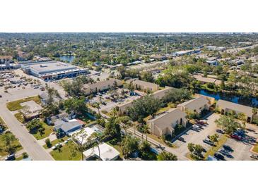 Aerial view of apartment community near shopping and water at 3421 Clark Rd # 122, Sarasota, FL 34231