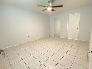 Bright bedroom with tile flooring and mirrored closet doors at 3750 59Th W Ave # 4096, Bradenton, FL 34210