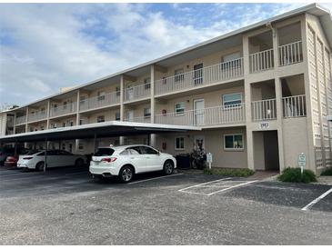 Two-story condo building with covered parking and ample space at 3983 Maceachen Blvd # 432, Sarasota, FL 34233