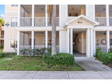 Inviting condo building exterior with covered entryway and lush landscaping at 4802 51St W St # 501, Bradenton, FL 34210