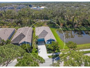 Aerial view of single-Gathering home with water view in a quiet community at 5213 Asher Ct, Sarasota, FL 34232