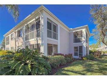 Well-maintained condo building with lush landscaping at 5697 Sheffield Greene Cir # 51, Sarasota, FL 34235