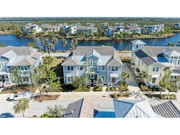 Aerial view of waterfront community with luxury homes at 311 Compass Point Dr # 201, Bradenton, FL 34209