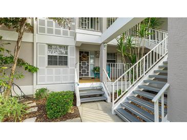 Inviting condo entrance with stairs and landscaping at 1109 Edgewater Cir # 1109, Bradenton, FL 34209