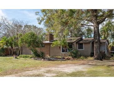 Ranch style home with mature landscaping and a spacious yard at 1205 Willis Ave, Sarasota, FL 34232