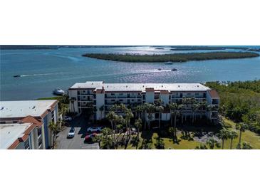 Aerial view of waterfront community with lush landscaping at 1751 Beach Rd # 404, Englewood, FL 34223