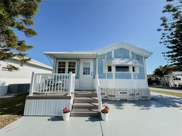 Cute light blue exterior with white trim and a deck at 3333 26Th E Ave # 1116, Bradenton, FL 34208