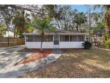 Cute bungalow with screened porch, fenced yard, and spacious driveway at 1376 18Th St, Sarasota, FL 34234