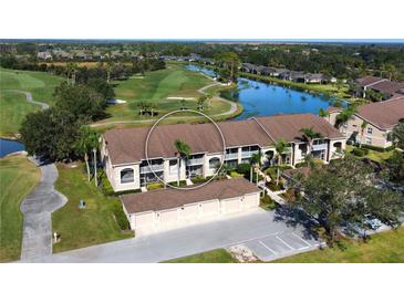 Aerial view of condo community near golf course and lake at 5281 Mahogany Run Ave # 822, Sarasota, FL 34241