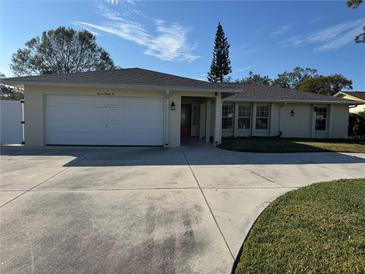 Single story home with attached garage and driveway at 732 Tuxford Dr, Sarasota, FL 34232