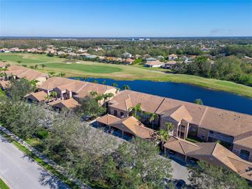 Aerial view of condo community near golf course and lake at 1003 Fairwaycove Ln # 101, Bradenton, FL 34212