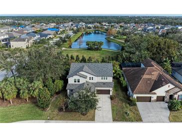 Two-story house with a lake view in a quiet community at 12941 Bliss Loop, Bradenton, FL 34211