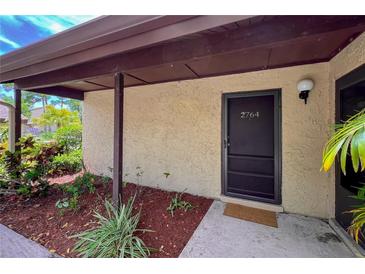 Inviting condo entrance with landscaped walkway at 2764 Hidden Lake Blvd # 2764, Sarasota, FL 34237