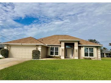 One-story home with a large front yard, attached garage, and neutral color palette at 87 Long Meadow Ln, Rotonda West, FL 33947