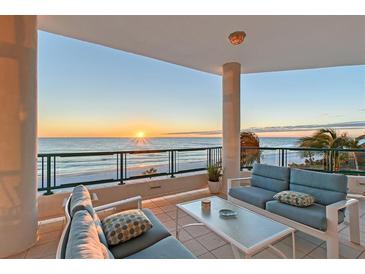 Spacious balcony with ocean views and comfortable seating, perfect for sunset viewing at 655 Longboat Club Rd # 14A, Longboat Key, FL 34228