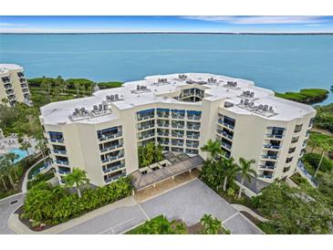 Luxury waterfront condo building with amazing water views and lush landscaping at 2110 Harbourside Dr # 526, Longboat Key, FL 34228