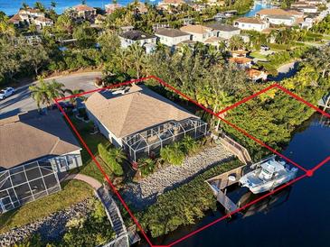 Luxury waterfront home with private dock and boat lift, nestled in a desirable community at 3832 5Th Ne Ave, Bradenton, FL 34208