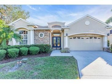 Beautiful home with stone accents and lush landscaping at 3832 5Th Ne Ave, Bradenton, FL 34208