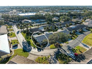 Aerial view of a condo community showing a single-story home with surrounding landscape at 390 301 W Blvd # 11D, Bradenton, FL 34205