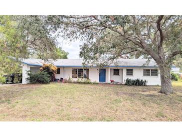 Ranch style home with carport and mature landscaping at 5507 28Th W St, Bradenton, FL 34207