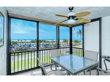 Enjoy breathtaking ocean views from this condo's relaxing patio area at 797 Beach Rd # 305, Sarasota, FL 34242