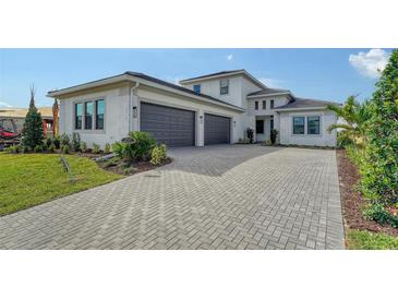 Two-story house with paver driveway at 4517 Mondrian Ct, Sarasota, FL 34240