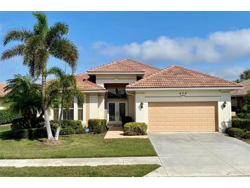 One-story home with tile roof, double doors, and attached garage at 636 Lakescene Drive Dr, Venice, FL 34293