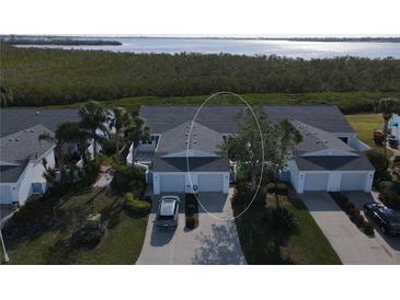 Aerial view of a waterfront community with single-Gathering homes at 919 Waterside Ln, Bradenton, FL 34209