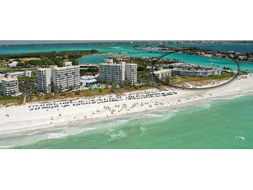 Aerial view of beachfront property with resort amenities and stunning ocean views at 100 Sands Point Rd # 323, Longboat Key, FL 34228