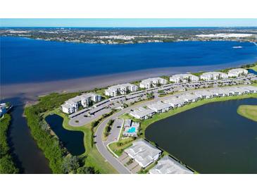Aerial view of waterfront community with resort-style amenities and parking at 1030 Tidewater Shores Loop # 306, Bradenton, FL 34208