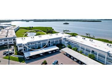Aerial view of waterfront community with pool and tennis courts at 4726 Independence Dr # 4726, Bradenton, FL 34210