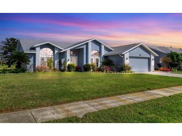 Beautiful home with a landscaped lawn and two-car garage at 4221 Augusta E Ter, Bradenton, FL 34203