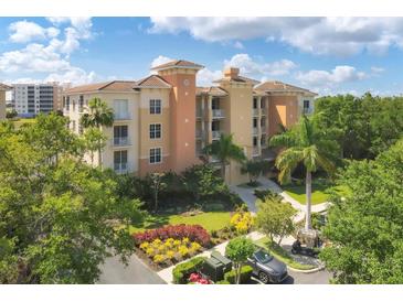 Luxury condo building with lake views and lush landscaping at 6310 Watercrest Way # 201, Lakewood Ranch, FL 34202