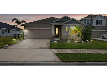 Attractive two-story home with landscaped yard and two-car garage at 11771 Richmond Trl, Parrish, FL 34219