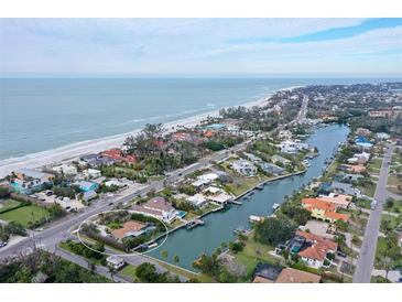 Aerial view of house near beach and waterway at 5830 Gulf Of Mexico Dr, Longboat Key, FL 34228