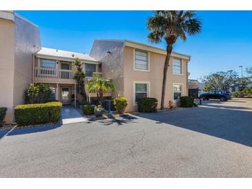 Two-story condo building with palm trees and parking at 6360 7Th W Ave # 6360, Bradenton, FL 34209