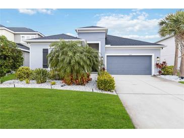 Attractive single-story home with landscaped lawn and two-car garage at 10531 Piedra Dr, Palmetto, FL 34221