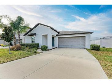 One story home with attached garage and landscaped lawn at 13262 Jeter Creek Dr, Riverview, FL 33579