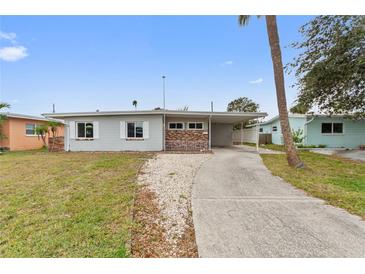 Ranch-style home with a carport and spacious yard at 4026 Indianapolis Ne St, St Petersburg, FL 33703