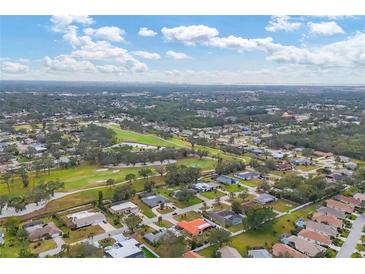 Aerial view of a residential neighborhood with golf course at 5006 W Country Club Dr, Sarasota, FL 34243