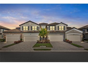 Attractive two-story home with three-car garage and landscaping at 6065 Worsham Ln # 104, Bradenton, FL 34211