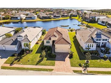 Luxury home with stunning lake views in a prestigious waterfront community at 6247 Champions Row St, Bradenton, FL 34210