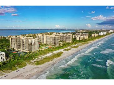 Aerial view of beachfront condo community with resort-style amenities at 1241 Gulf Of Mexico Dr # 703, Longboat Key, FL 34228