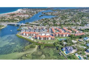 Aerial view of waterfront community with resort-style amenities at 1618 Stickney Point Rd # 1618-202, Sarasota, FL 34231