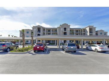 Exterior view of building with covered parking and landscaping at 17724 Gawthrop # 103, Bradenton, FL 34211