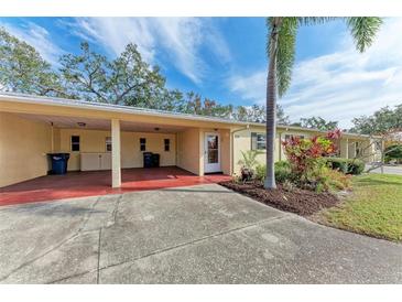 Single-story home with carport and landscaped yard at 390 301 W Blvd # 8C, Bradenton, FL 34205