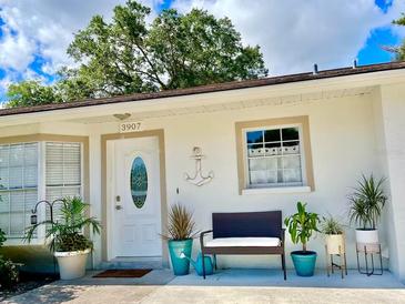 Inviting front entrance with porch and landscaping at 3907 10Th Avenue W Dr, Bradenton, FL 34205